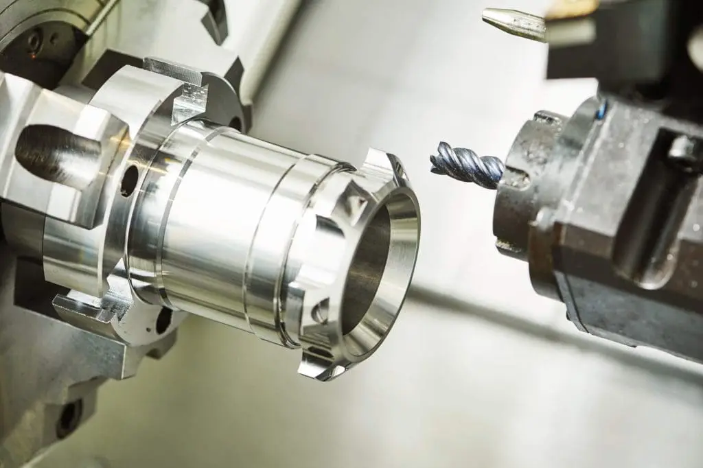 dreamstime_m_71145711 Industrial metalworking cutting process by milling cutter. Metalworking machining cutting process of blank detail by milling cutter with hardmetal carbide insert at modern cnc machine.
